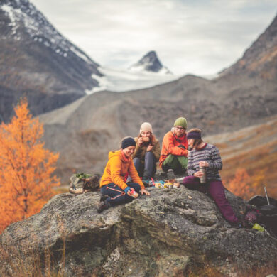 Scenic hiking trail in the Lyngen Alps overlooking the Lyngenfjord with dramatic Arctic mountain landscape